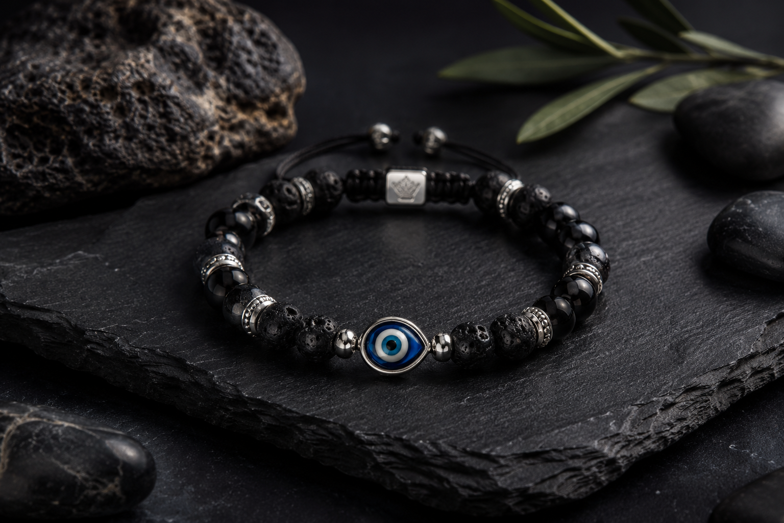 Evil eye 925 silver bracelet with natural stones, handmade Greek mati bracelet on dark stone background.